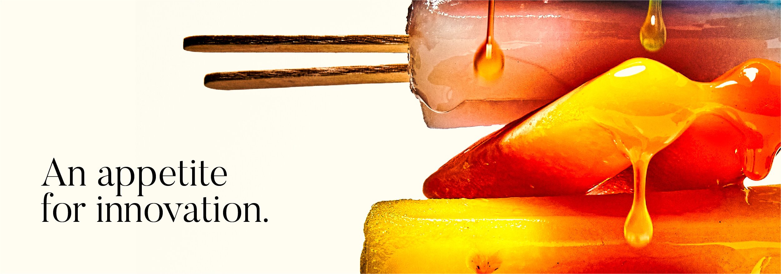 A close-up of dripping honeycomb and honey with text that says 'An appetite for innovation.'