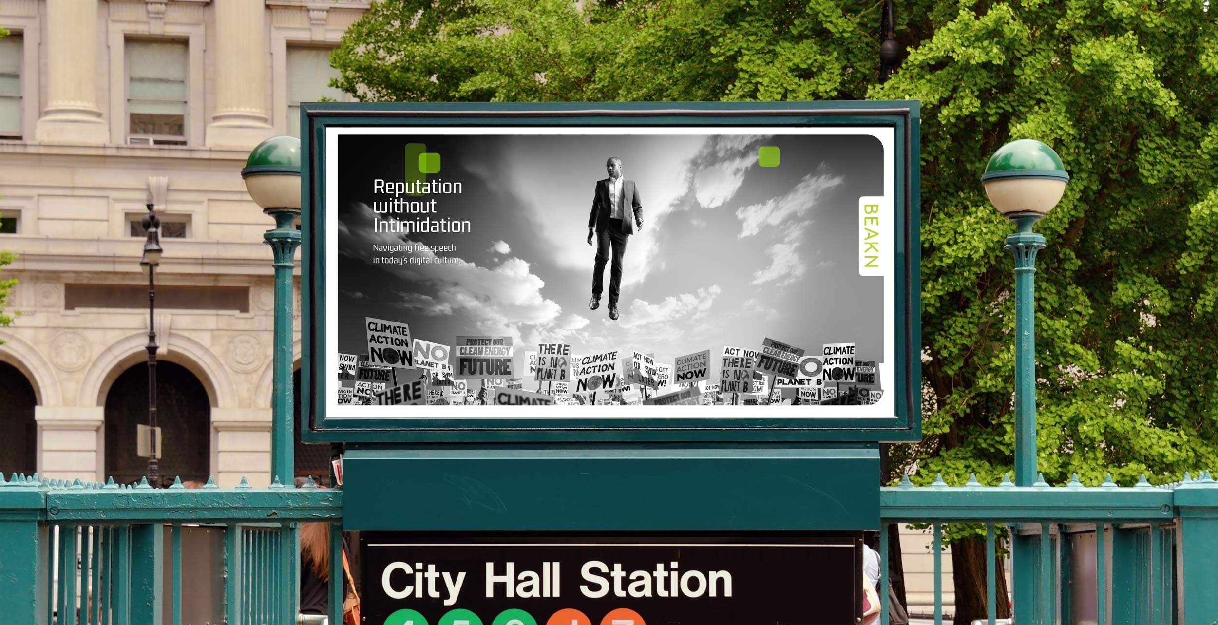 Billboard at City Hall Station with a black and white image of a man in a suit floating above protest signs about climate action and digital culture.