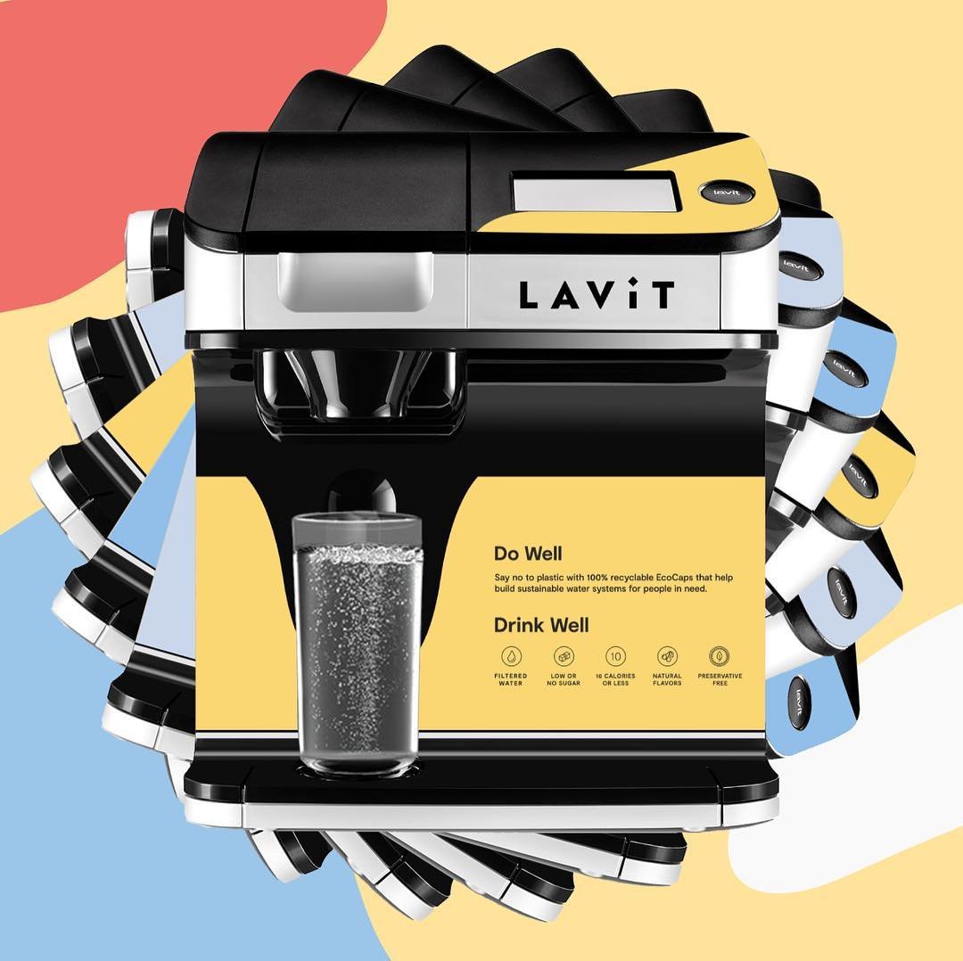 A Lavit beverage machine with multiple colored pods around it, displaying a glass of sparkling water and text promoting eco-friendly reusable pods.