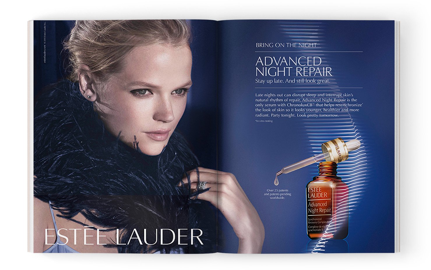 A woman with blonde hair styled in an updo, wearing earrings and a black feathered accessory, is featured on the left page of an advertisement for Estée Lauder's Advanced Night Repair serum. The right page has a blue background with white text explai
